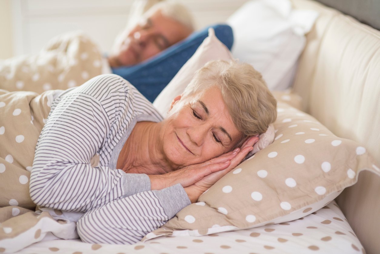 Older woman sleeping - With the best pillow for your needs, a contented night's sleep is easy