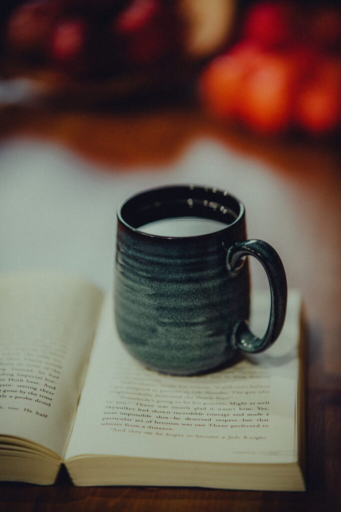 A cup of valerian tea sat on an open book