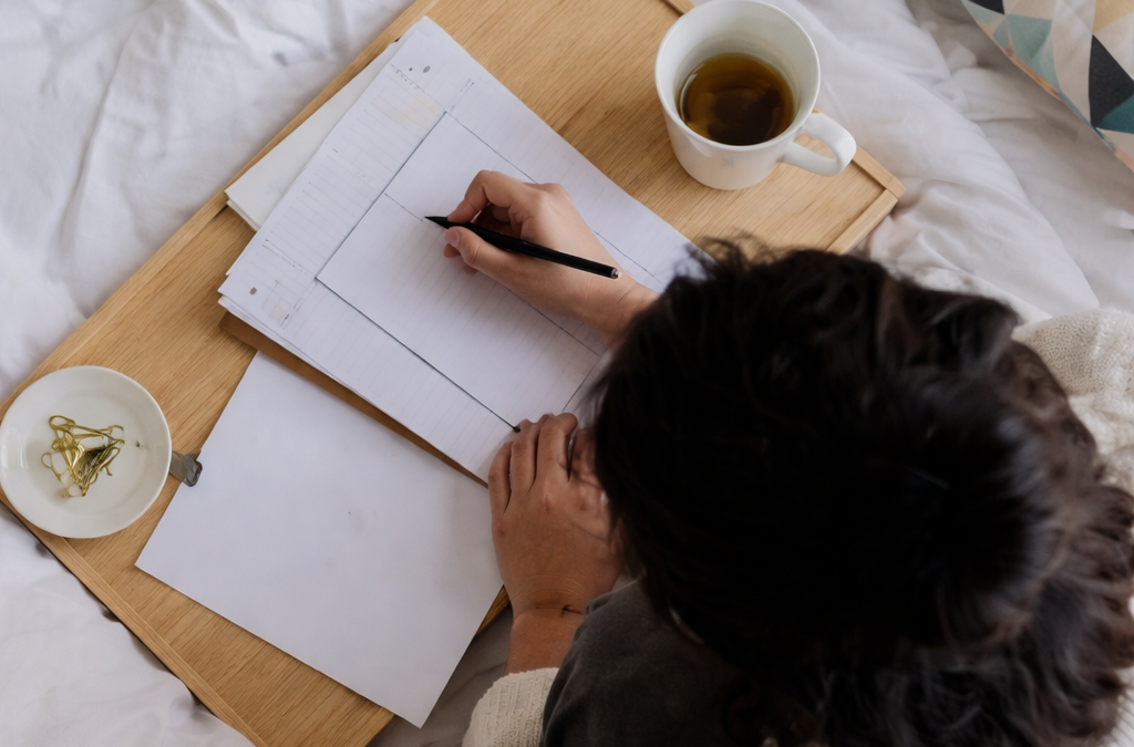 Writing and tea on a cosy bed