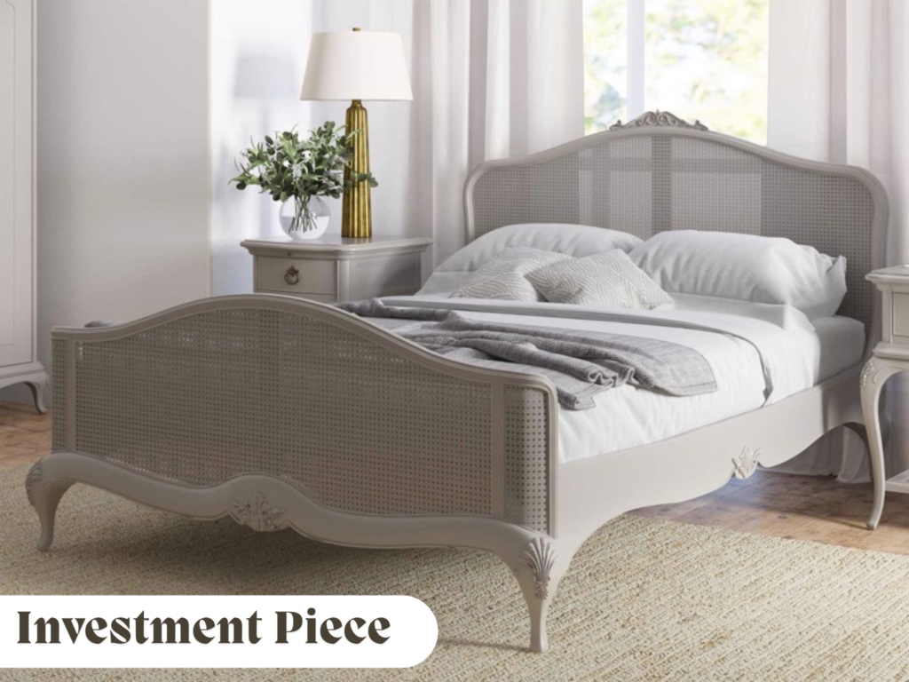 Grey rattan bed frame in naturally lit room with flowers
