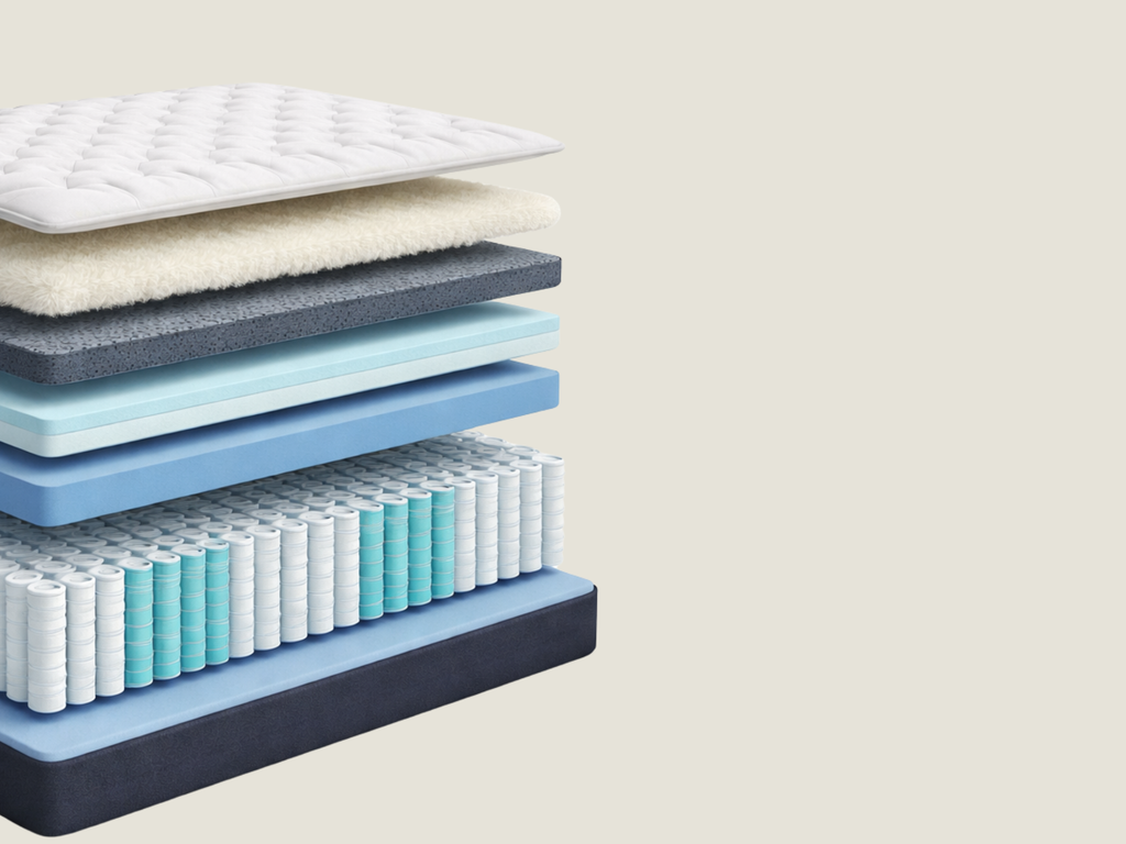 Inside a hybrid mattress showing comfort layers and pocket springs